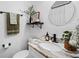 This is a lovely bathroom with a unique vanity, black fixtures, and modern decor at 1815 6Th Se St, Winter Haven, FL 33880