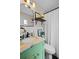 Bathroom featuring a stylish green vanity and marble sink at 1815 6Th Se St, Winter Haven, FL 33880