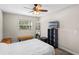Bedroom with hardwood floors, ceiling fan, and plenty of natural light at 1815 6Th Se St, Winter Haven, FL 33880