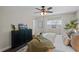 Bright bedroom featuring neutral decor, comfortable bedding, and a classic ceiling fan at 1815 6Th Se St, Winter Haven, FL 33880