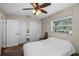 Bedroom featuring built-in closets, a ceiling fan, and natural light at 1815 6Th Se St, Winter Haven, FL 33880