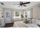 Bright bedroom featuring a back door and large windows at 1815 6Th Se St, Winter Haven, FL 33880