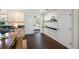 The dining room features hardwood floors and is adjacent to the kitchen and bedroom at 1815 6Th Se St, Winter Haven, FL 33880