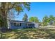 Charming single-story home with a well-manicured lawn, inviting front porch and a one car garage at 1815 6Th Se St, Winter Haven, FL 33880
