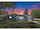 Charming single-story home with a well-manicured lawn and inviting front porch, perfect for relaxing evenings at 1815 6Th Se St, Winter Haven, FL 33880