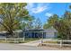 Charming single-story home with a well-manicured lawn, inviting front porch and a one car garage at 1815 6Th Se St, Winter Haven, FL 33880