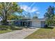 Charming single-story home with a well-manicured lawn, inviting front porch and a one car garage at 1815 6Th Se St, Winter Haven, FL 33880