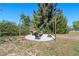 Backyard fire pit area offers a perfect spot for outdoor entertaining and relaxation at 1815 6Th Se St, Winter Haven, FL 33880