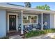 Inviting front porch with swing, decor, and plenty of space to relax at 1815 6Th Se St, Winter Haven, FL 33880