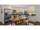 Charming kitchen features stainless steel appliances, granite countertops, and a cozy dining area at 1815 6Th Se St, Winter Haven, FL 33880