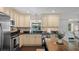 Well-lit kitchen with stainless steel appliances and a breakfast bar, perfect for casual dining at 1815 6Th Se St, Winter Haven, FL 33880