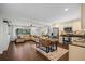 Spacious living area features a modern kitchen, dining set, and comfortable seating arrangement at 1815 6Th Se St, Winter Haven, FL 33880