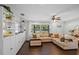 Inviting living room with a large sectional sofa and built-in shelving for modern comfort at 1815 6Th Se St, Winter Haven, FL 33880