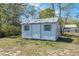 Outdoor shed in backyard offers extra storage space for tools or hobbies at 1815 6Th Se St, Winter Haven, FL 33880