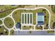 Aerial view of bocce ball and shuffleboard courts with parking at 1959 Keel Ct, The Villages, FL 34762