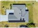 Aerial shot of roof with solar panels, landscaping, and concrete driveway at 1959 Keel Ct, The Villages, FL 34762