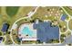 Aerial view of the community pool, recreation center, and surrounding landscape at 1959 Keel Ct, The Villages, FL 34762