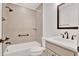 Bathroom featuring tile shower and tub, modern vanity, and bronze fixtures at 1959 Keel Ct, The Villages, FL 34762