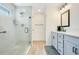 Modern bathroom featuring a glass shower and a double sink vanity with sleek hardware at 1959 Keel Ct, The Villages, FL 34762
