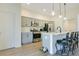 Stylish kitchen featuring stainless steel appliances, a breakfast bar with seating, and plenty of cabinet space at 1959 Keel Ct, The Villages, FL 34762