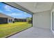 Screened in patio with a view of the backyard at 1959 Keel Ct, The Villages, FL 34762
