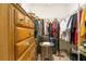 Organized walk-in closet featuring shelving, hanging rods, drawers, and ample storage space at 1959 Keel Ct, The Villages, FL 34762