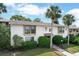 Exterior of a well-maintained condo building with palm trees and manicured landscaping at 200 Maitland Ave # 86, Altamonte Springs, FL 32701