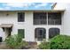 Exterior view featuring a screened in patio and balcony area with surrounding greenery at 200 Maitland Ave # 86, Altamonte Springs, FL 32701