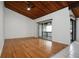 Spacious living room with hardwood floors, a wood ceiling, and access to a balcony at 200 Maitland Ave # 86, Altamonte Springs, FL 32701