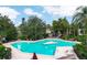 Inviting community pool with lounge chairs, umbrellas, and lush landscaping for relaxing days in the sun at 200 Maitland Ave # 86, Altamonte Springs, FL 32701