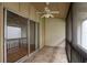 Porch with tile flooring and ceiling fan looking out through sliding glass doors at 200 Maitland Ave # 86, Altamonte Springs, FL 32701