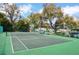 Well-maintained tennis court with lush surroundings, offering a great space for recreation and exercise at 200 Maitland Ave # 86, Altamonte Springs, FL 32701