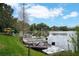 Waterfront view with boats along the shore, showcasing a serene setting for waterfront living at 200 Maitland Ave # 86, Altamonte Springs, FL 32701