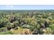 An aerial view of a home among dense trees, creating a private setting at 20240 Sw 95Th St, Dunnellon, FL 34431