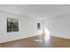 Bedroom featuring bright white walls, laminate floors, and two windows at 20240 Sw 95Th St, Dunnellon, FL 34431