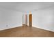 The bedroom features a light-colored laminate floor, and two doors at 20240 Sw 95Th St, Dunnellon, FL 34431
