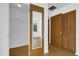 View of a walk-in closet with a mirrored door and wood-slatted doors at 20240 Sw 95Th St, Dunnellon, FL 34431