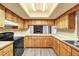 Well-lit kitchen features light countertops and wood cabinets at 20240 Sw 95Th St, Dunnellon, FL 34431