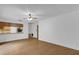 Open living area with view into the kitchen and light-colored walls at 20240 Sw 95Th St, Dunnellon, FL 34431