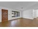 Living room with large window for natural light and wood-look laminate flooring at 20240 Sw 95Th St, Dunnellon, FL 34431