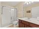 Bathroom featuring a glass enclosed shower, toilet and single sink vanity at 2508 Archfeld Blvd, Kissimmee, FL 34747