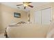Bedroom features a queen-size bed, TV, bedside tables with lamps, and closet at 2508 Archfeld Blvd, Kissimmee, FL 34747