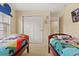 Themed bedroom includes two twin beds and large closet at 2508 Archfeld Blvd, Kissimmee, FL 34747