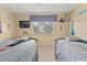 Themed bedroom includes two twin beds with TV, ceiling fan, and themed decor at 2508 Archfeld Blvd, Kissimmee, FL 34747
