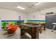 Versatile game room with a foosball table, pool table, and ample space for entertainment at 2508 Archfeld Blvd, Kissimmee, FL 34747