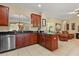 Spacious kitchen with granite countertops, stainless steel dishwasher, and access to living area at 2508 Archfeld Blvd, Kissimmee, FL 34747