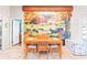 Charming dining room with an autumn mural adding character and warmth to the space, and featuring a cozy, inviting atmosphere at 25322 Felicity Ct, Leesburg, FL 34748