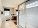 Bathroom with a glass door shower and soaking tub with a double vanity at 2548 Archfeld Blvd, Kissimmee, FL 34747