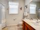 Bathroom featuring a vanity and toilet, with a shower that offers both style and function at 2548 Archfeld Blvd, Kissimmee, FL 34747