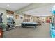 Spacious game room with pool tables, air hockey, and an arcade simulator at 2548 Archfeld Blvd, Kissimmee, FL 34747